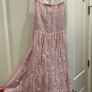 Never been worn! Baby doll pink dress! Perfect condition! Ties in the back.
